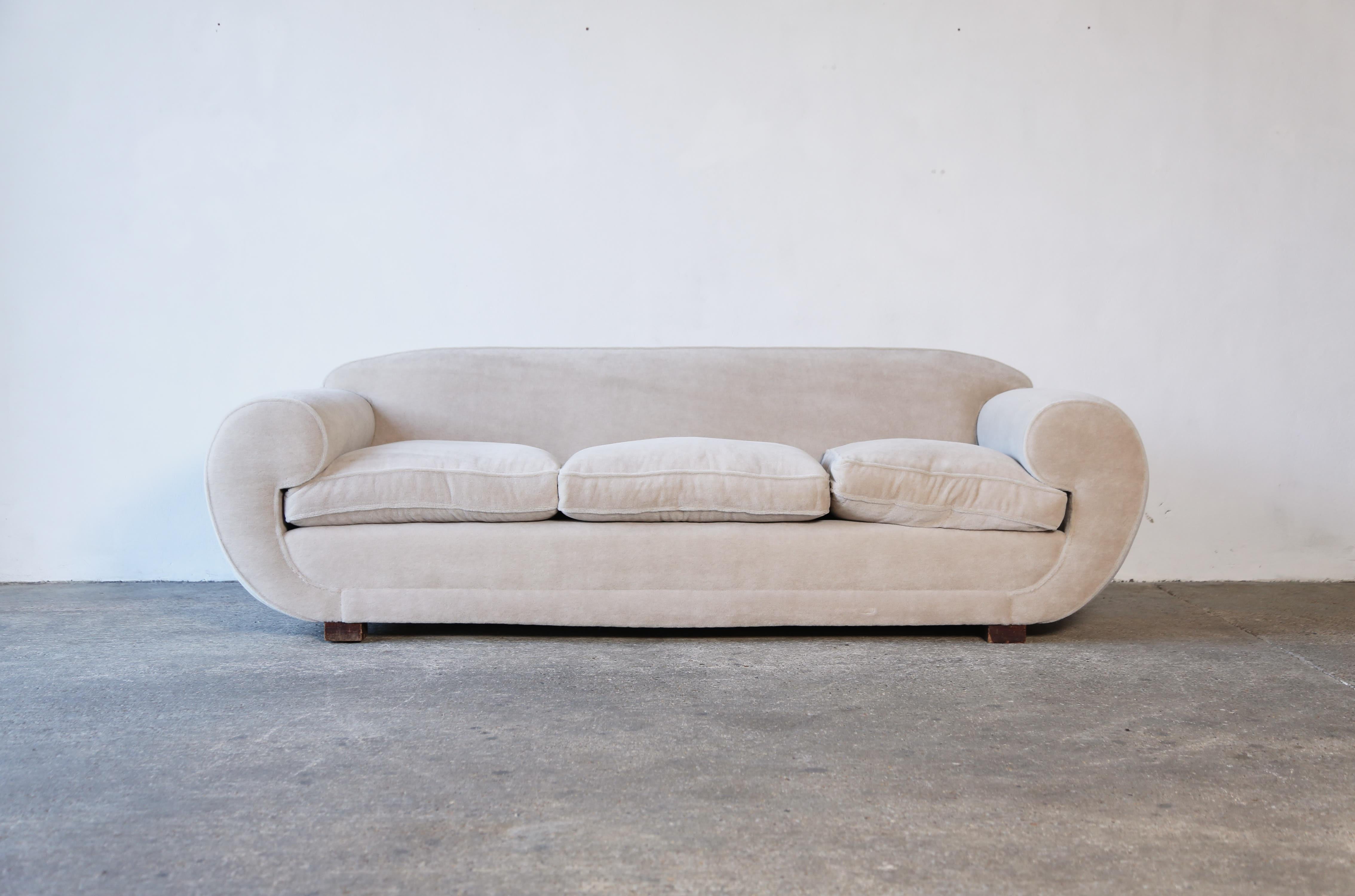A superb Art Deco sofa, France, 1940s, re-upholstered in a luxurious pure Alpaca wool fabric.  Fast shipping worldwide.