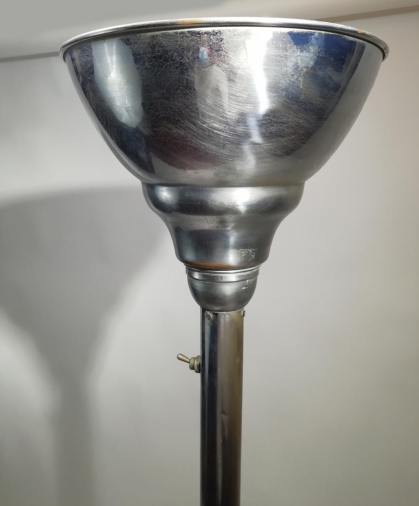 Art Deco up-lighter floor lamp consist of a round base, a shaft and a trumpet torchiere made in aluminum.
It gives off the best ambient lighting to a room.
It Accommodate one candelabra bulb: 150 Watts
Can be delivered and wired for American or