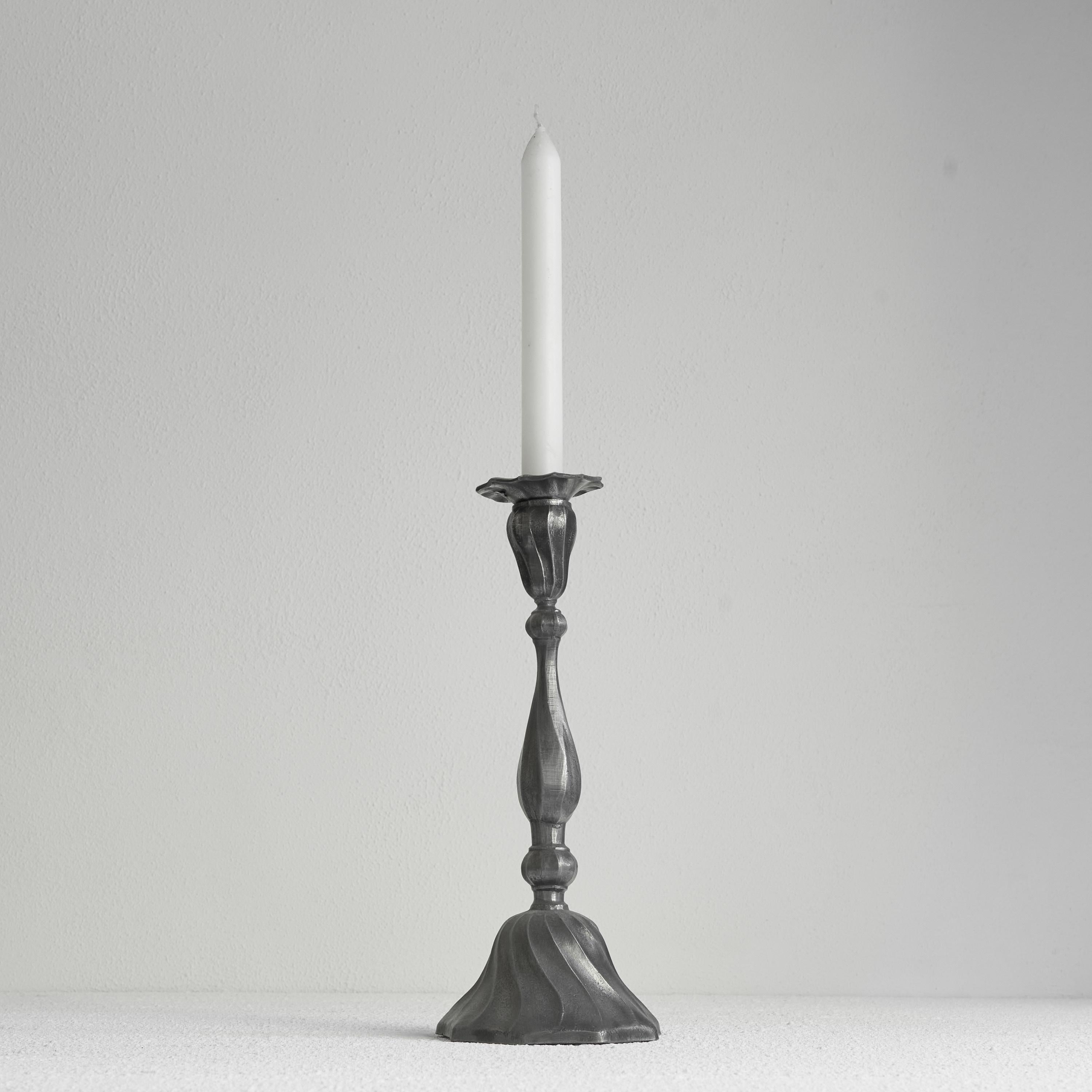 Elegant Art Nouveau candlestick in Pewter 1920s.

Very elegant and large candlestick with a very distinct Art Nouveau style. Organic and joyful, this candlestick is interesting from every corner. The patinated pewter surface is very stylish and