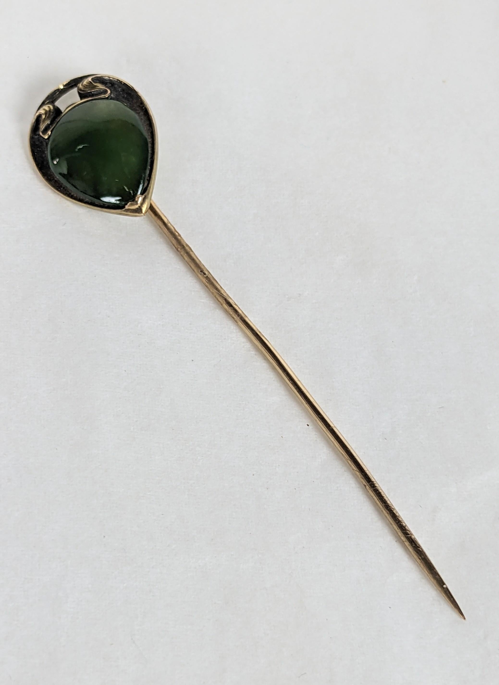 Elegant Art Nouveau Jade Stickpin in 14k gold from early 1900's. Pear shaped jade panel set into whiplash patianed gold setting. 2.65