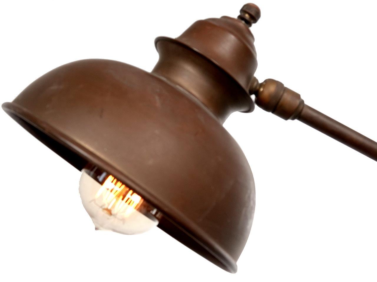 This articulating lamp too nice to have been a workshop lamp. It may have been used in a doctors office or as library reading lamp. The look is delicate and well balanced. It comes with a long twisted fabric covered cord and plug. The finish is