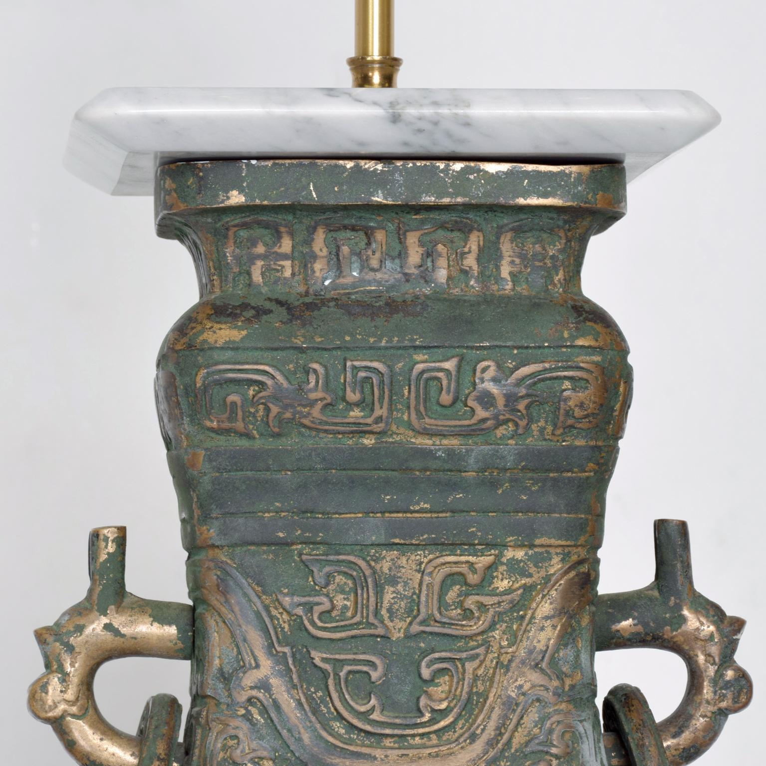 For your consideration: an elegant Asian table lamp in bronze. Unmarked. Attributed to James Mont. 

Dimensions are: 30 1/2