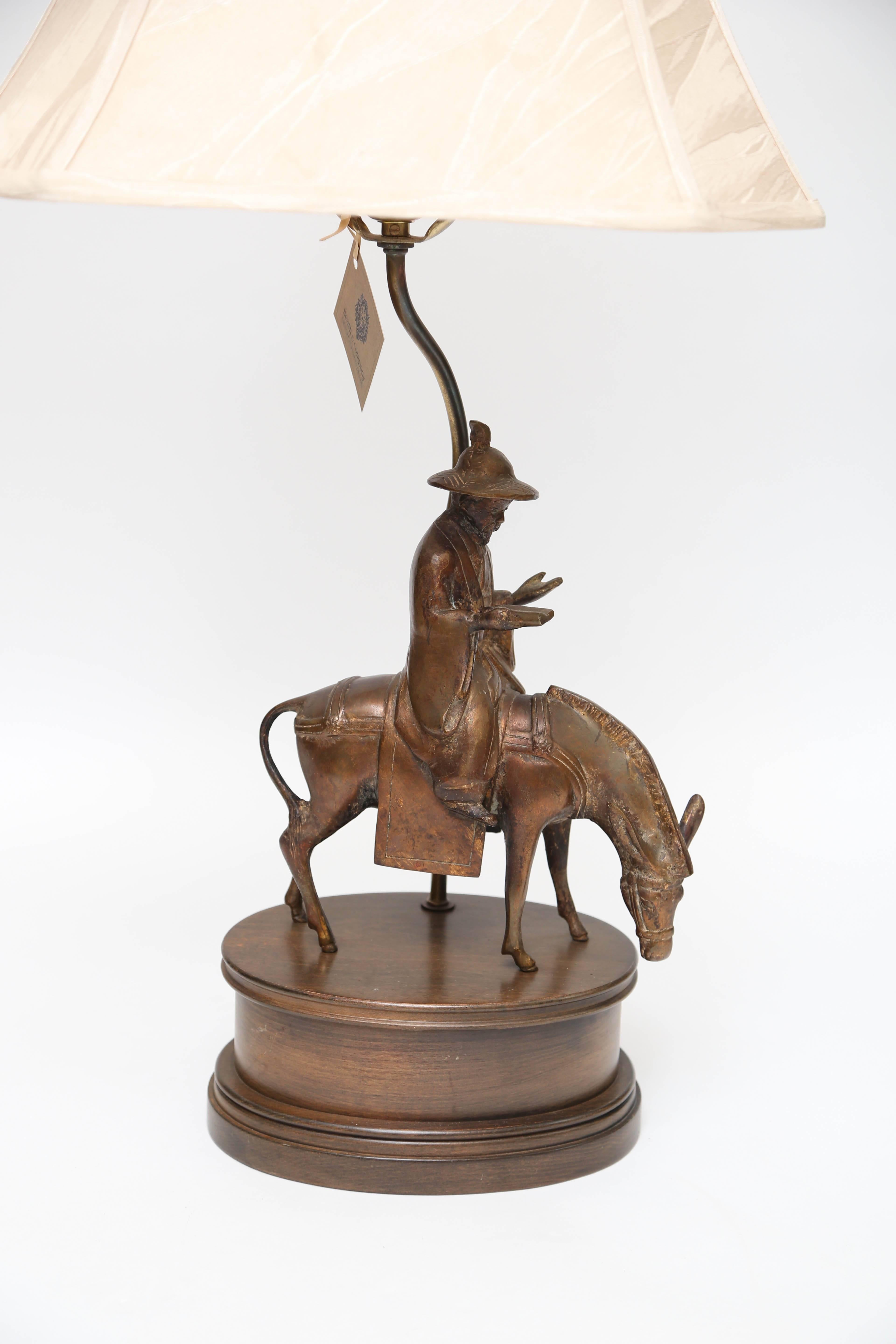 Elegant Asian Man and donkey lamp by Maitland-Smith with rectangle 16' lampshade.9'' W x 7' D (base); 11' figurine; 34' H (overall to top off finial).