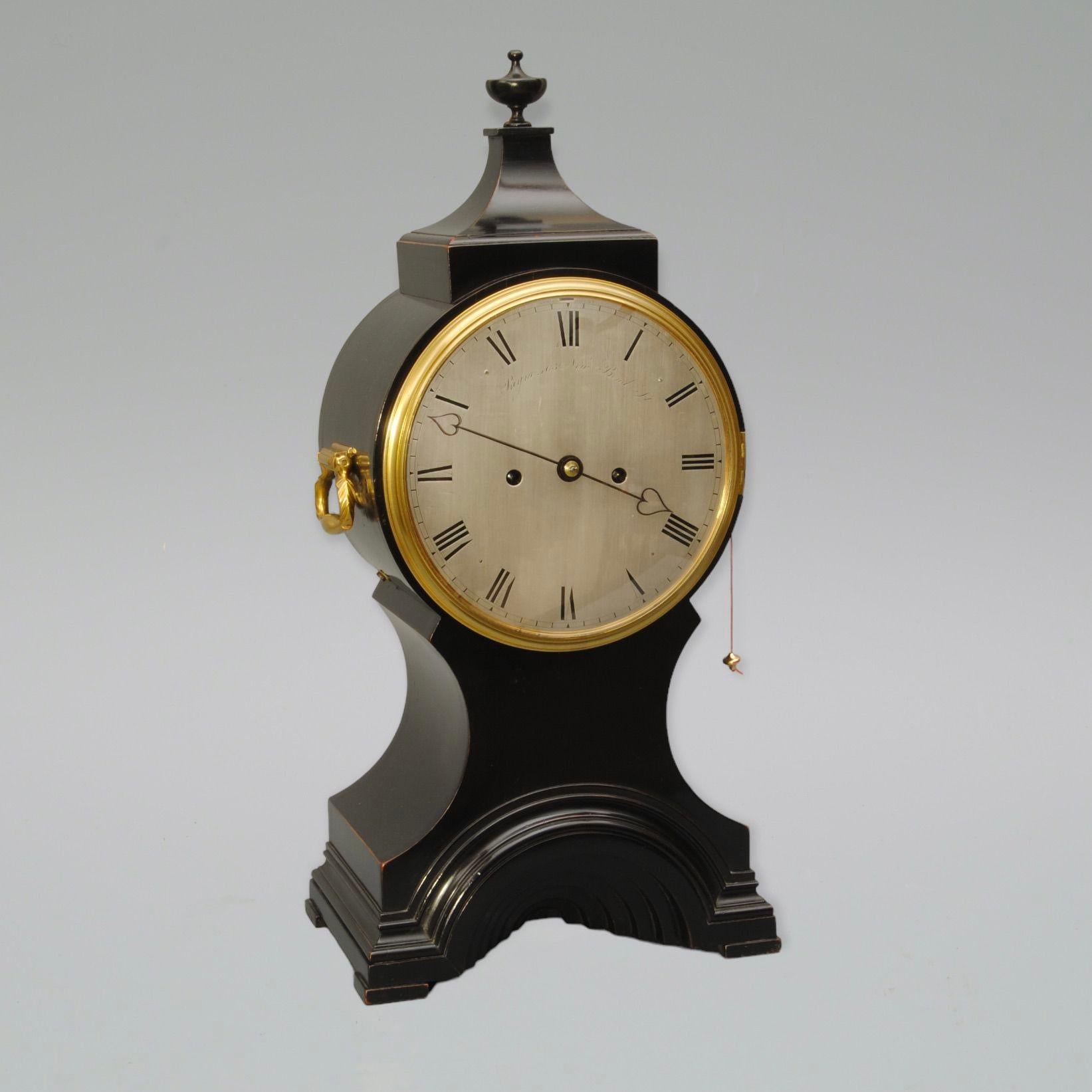 An 8 day ebonised ballon bracket clock by Payne, London. The silvered dial with the original elegant heart shaped hands.
The elegant case has an unusual moulded tunnel design to the base instead of being an open design.
The movement is also signed