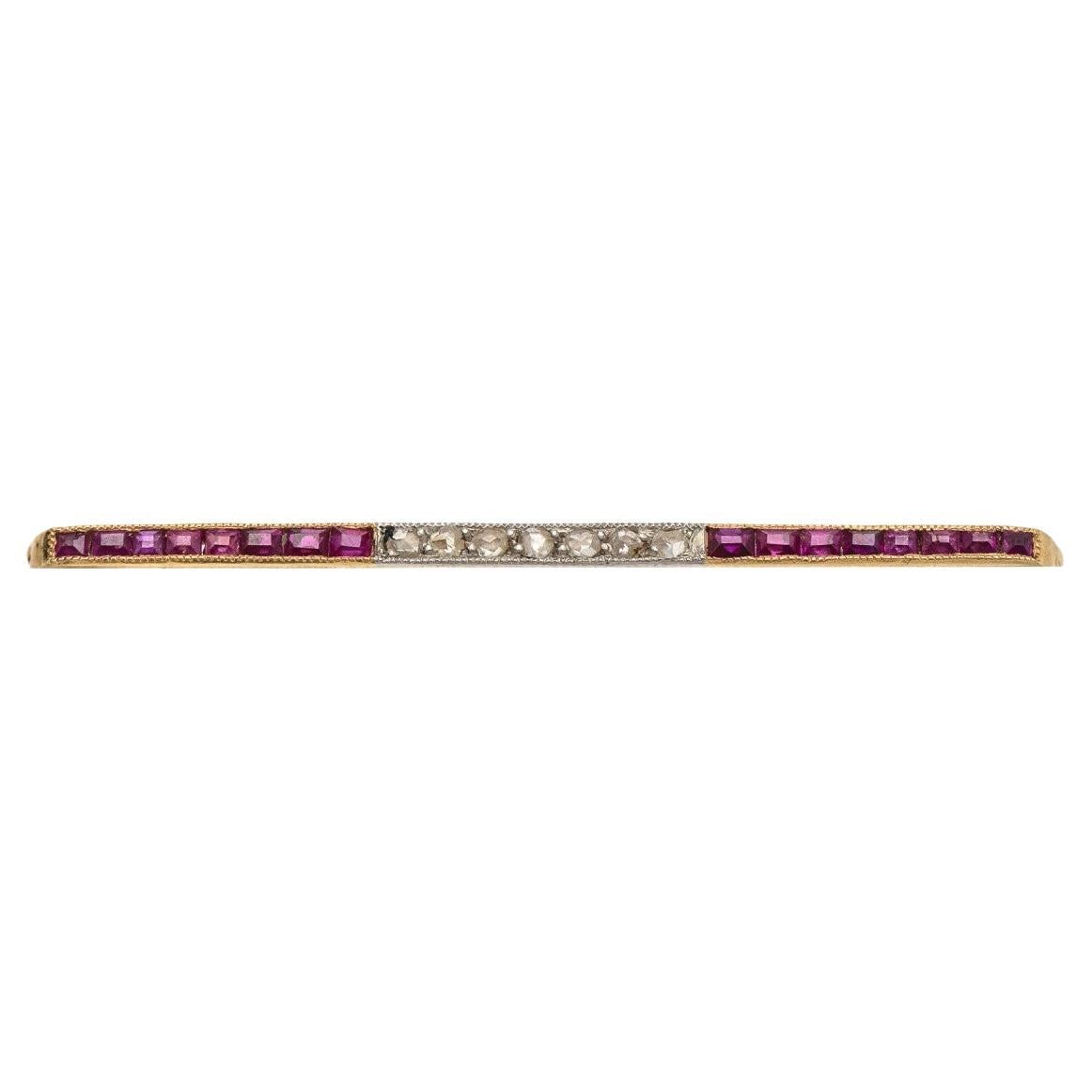 Elegant bar golden brooch with rubies and diamonds, Spain, circa 1940s.