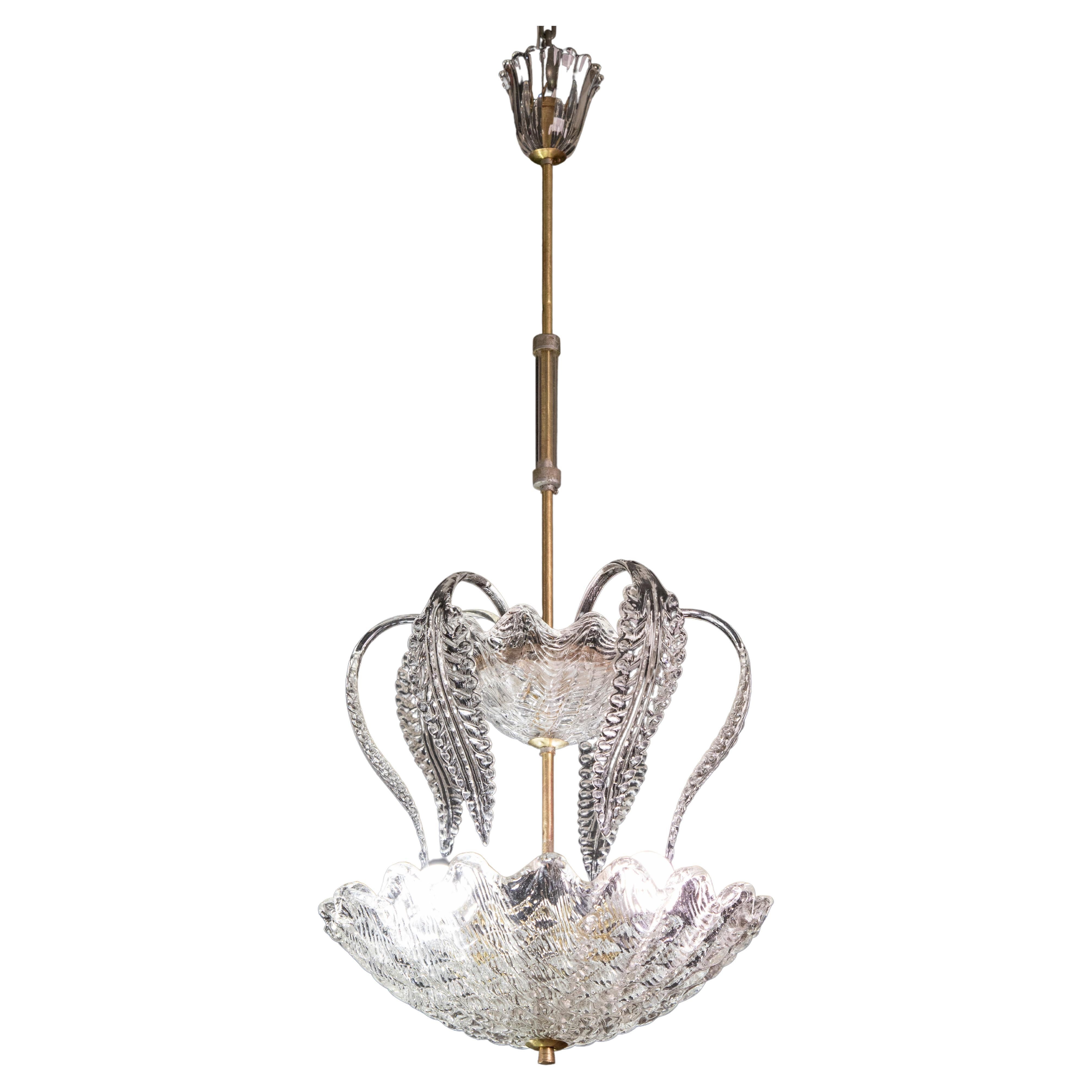Splendid Art Deco chandelier attributed to Ercole Barovier made by the Barovier & Toso glassworks in the 1940s-1950s.
The chandelier is 95cm high and 40cm wide.
The glass elements make this fountain pendant extremely unique.
All glass and frame are