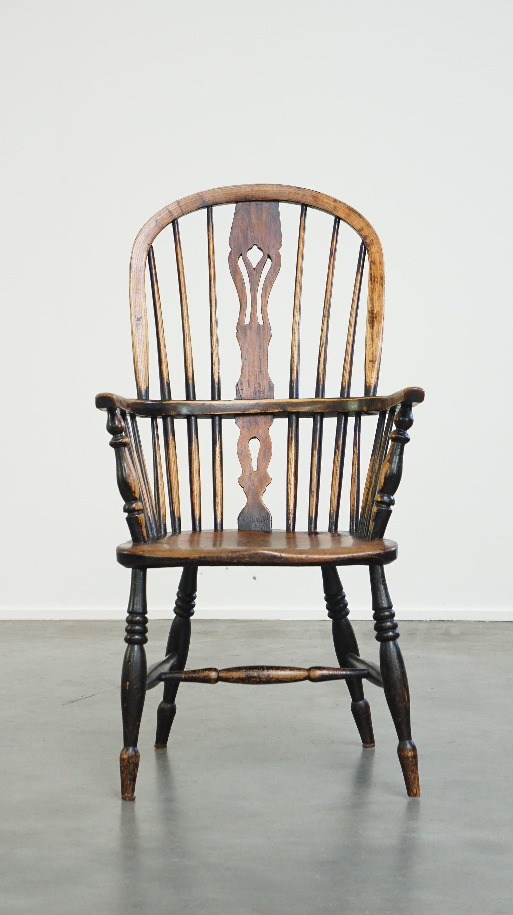 This wonderful antique Windsor dining chair has developed a beautiful patina over the years. It features a spindled backrest and a beautifully shaped seat. Not only is it functional, but it also adds that extra touch of elegance to almost any