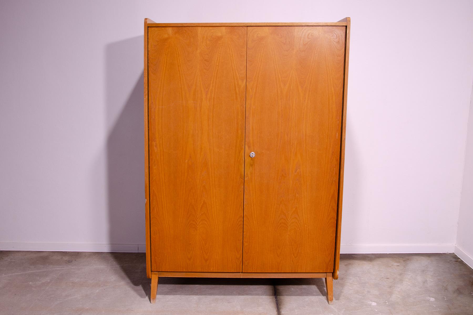 This wardrobe was designed by František Jirák for Tatra nábytok company in the former Czechoslovakia in the 1960´s

It´s made of beechwood and plywood. There are 8 shelves inside, but they are removable.

You can hang your clothes in it, as well as