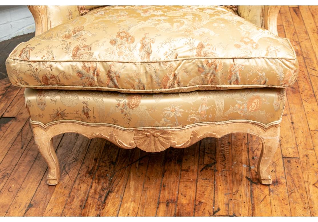 This elegant vintage chair, has a loose seat cushion and back pillow.
A comfortable seat with down filled cushion and pillow.
The silk fabric depicts Chinoiserie scenery.
The painted frame has a soft cream finish.
Dimensions: 33” wide x 31” deep