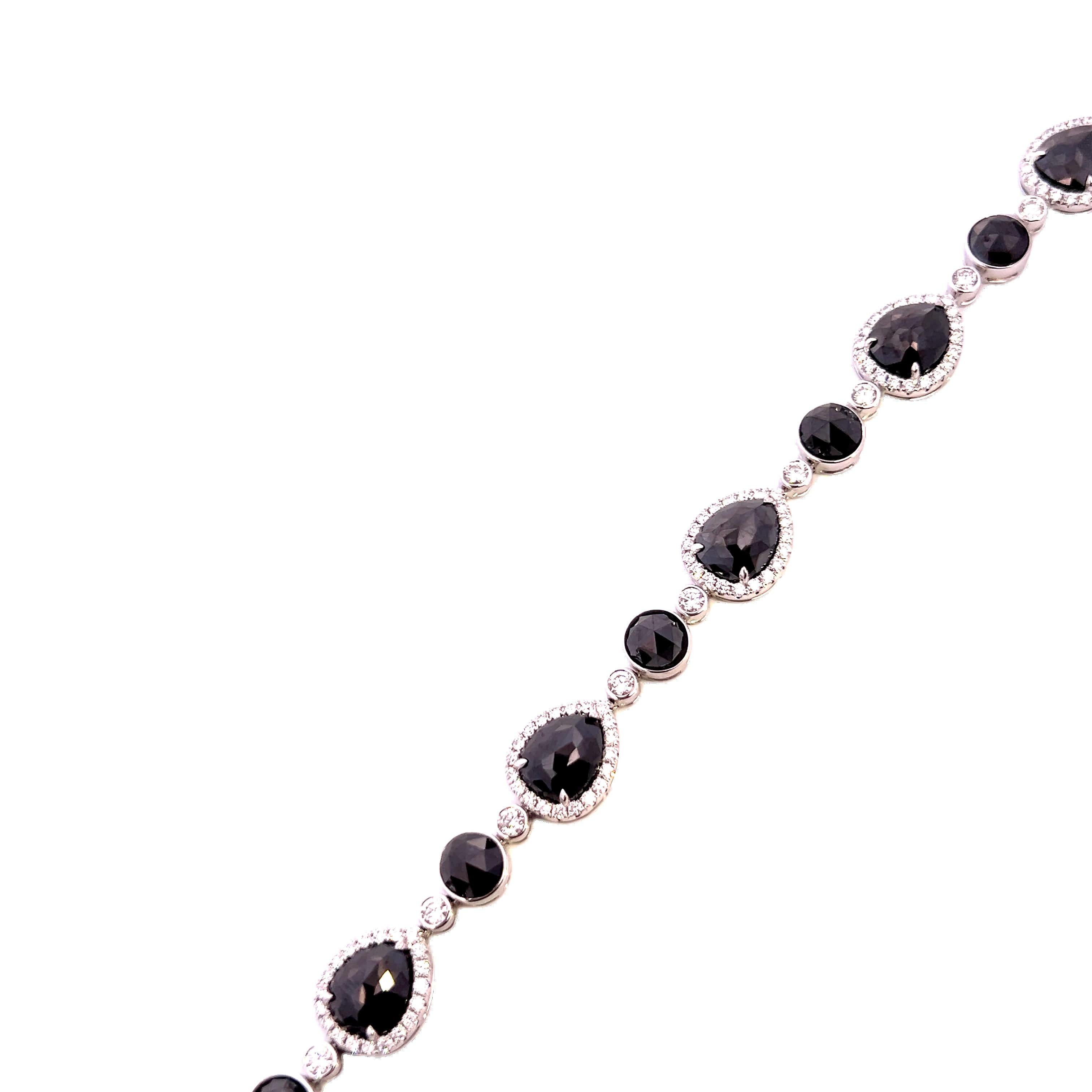 This exquisite bracelet features a series of stunning black gemstones, each encased in a delicate silver setting. Perfect for adding a touch of sophistication to any outfit, this piece is both timeless and elegant.