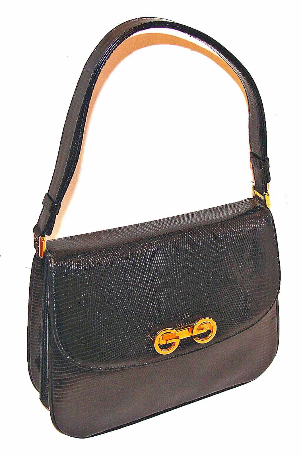 This classic handbag is a newly acquired black lizard structured bag from a long-time bag collector.  She was the original owner and we acquired several classic pieces from her collection.    She appreciated these choice pieces and took great care