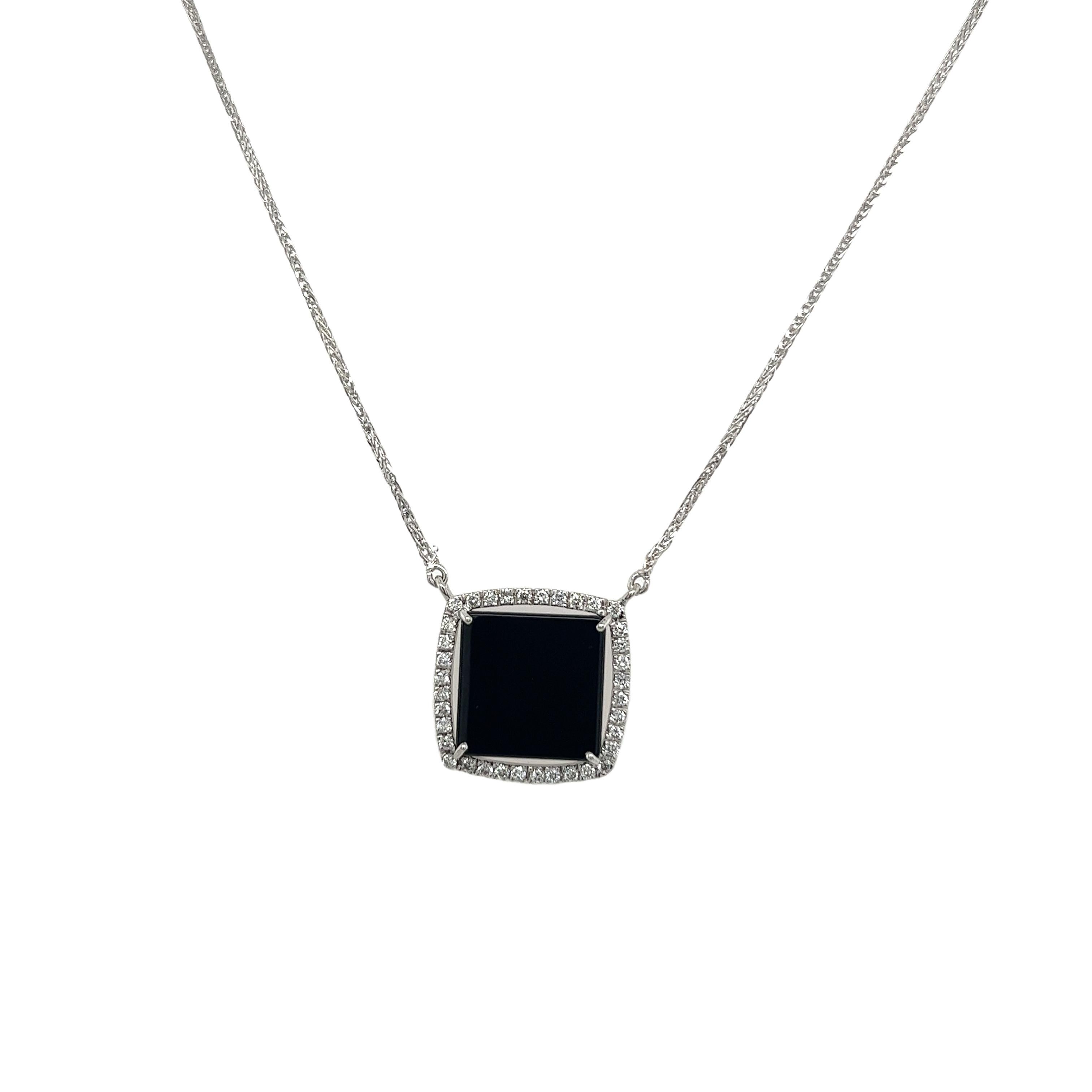 Add a touch of timeless elegance to your jewellery collection with this exquisite pendant. Crafted in luxurious 18ct white gold, this pendant features a stunning black onyx centerpiece adorned with 0.25ct sparkling diamonds on halo.

Chain Length:
