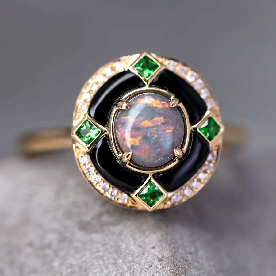 Elegant Black Opal, Diamond, and Tsavorite Engagement Ring with Black Agate in 18K Yellow Gold.


Free Domestic USPS First Class Shipping! Free Gift Bag or Box with every order!

Opal—the queen of gemstones, is one of the most beautiful gemstones in