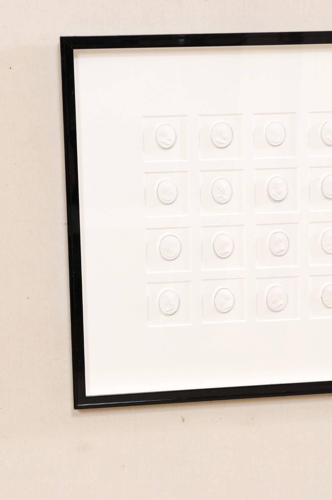 Elegant Black Wall Frame Featuring a Collection of White Intaglios In Excellent Condition In Atlanta, GA