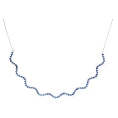 Elegant Blue Sapphire 18K White Gold Wave Necklace