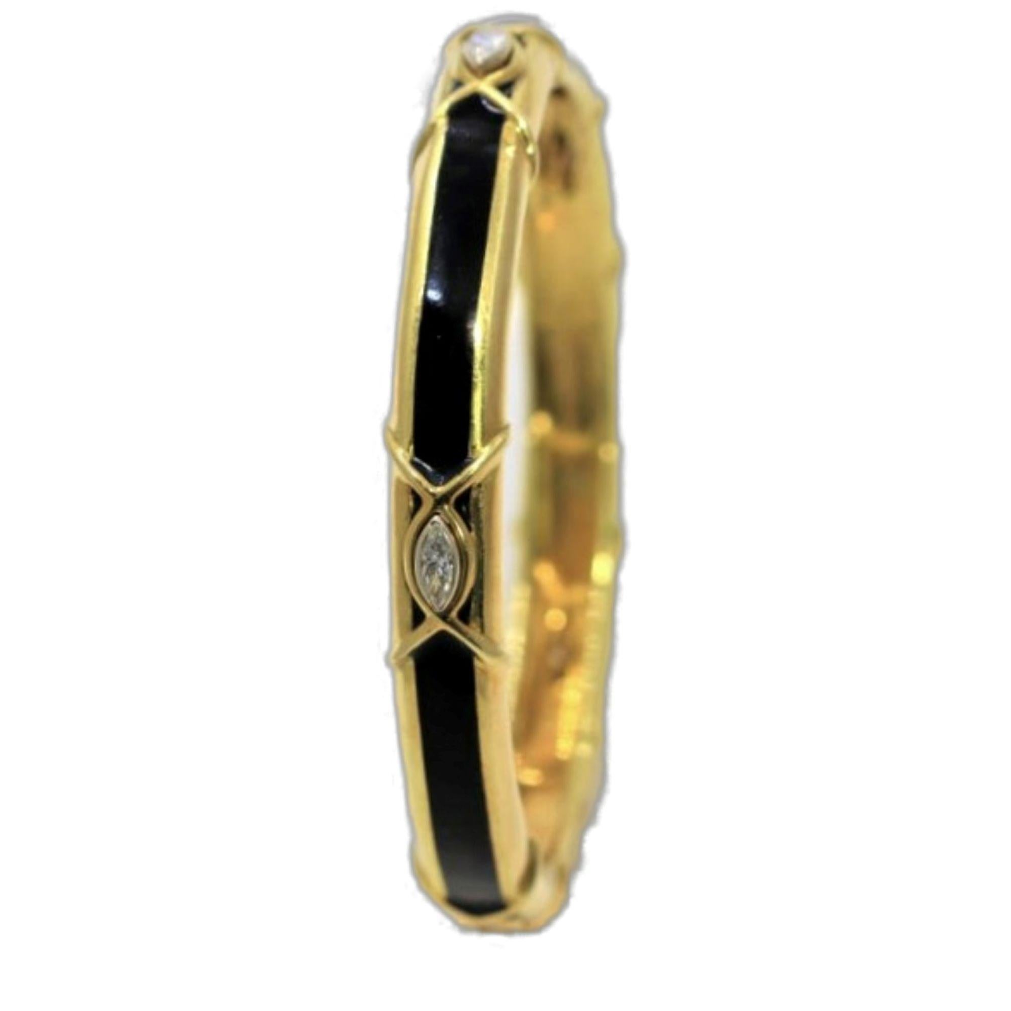 This distinctive and stylish bangle bracelet is crafted in 18k yellow gold and features a bold strip of black enamel punctuated by four fine quality marquise diamonds with a total approximate weight of 1.00ct. At 9.5mm in width it is a stand alone