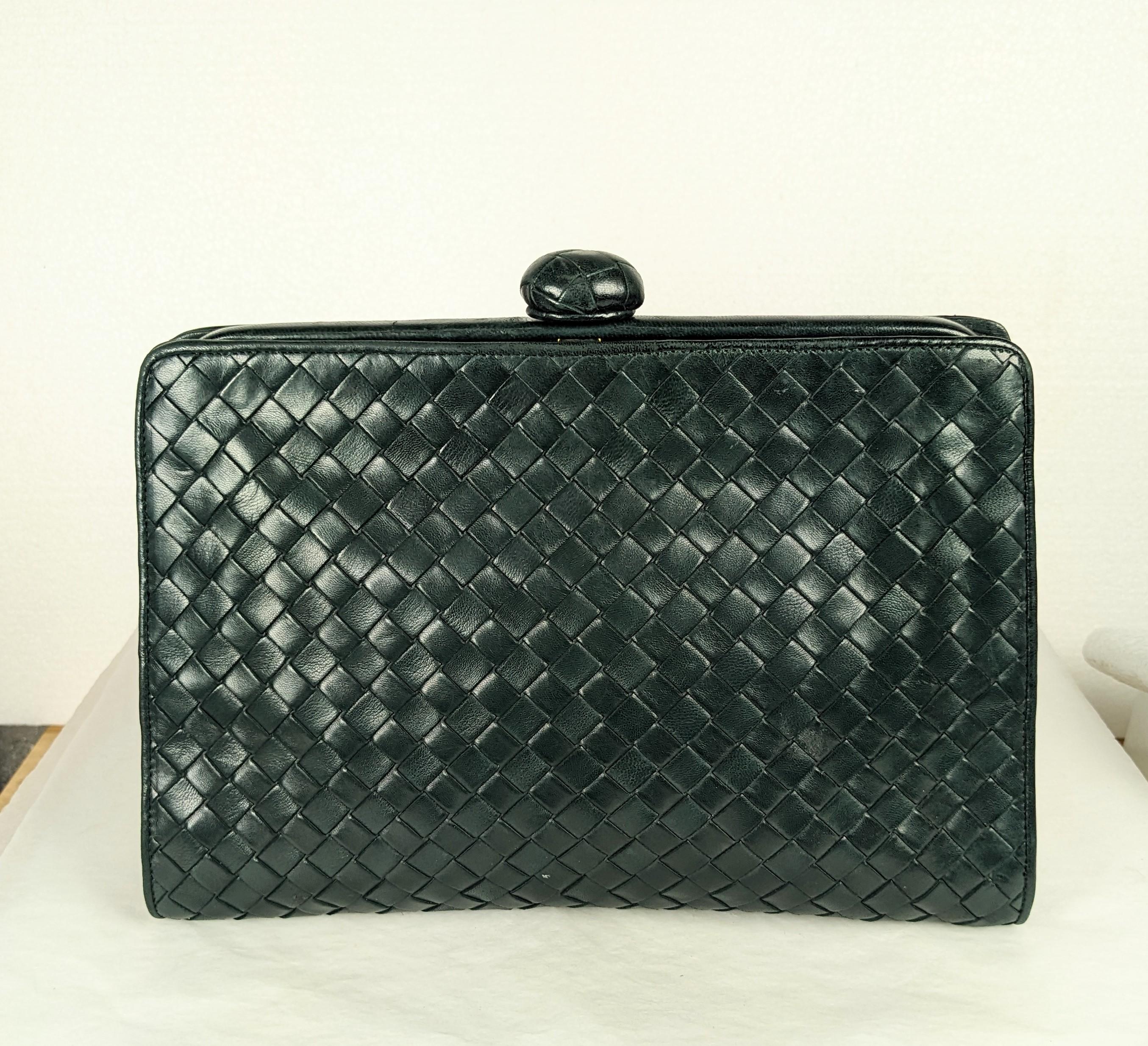 Elegant Bottega Veneta Forest Green Intrecciato Leather Clutch from the 1990's. Classic styling, incredible quality with woven leather toggle as well. 1990's Italy. 10