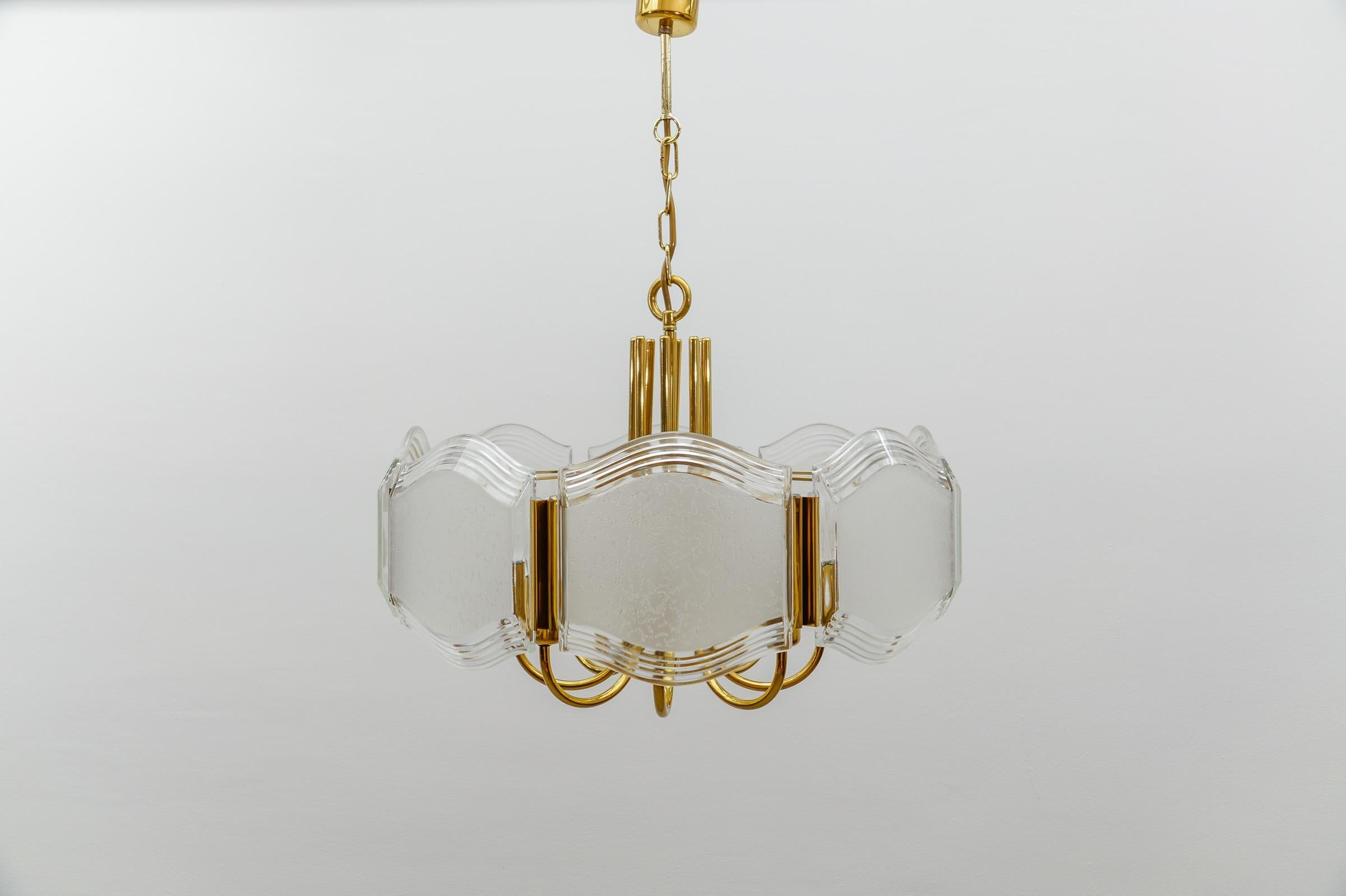Elegant Brass and Glass Chandelier / Ceiling Lamp, Germany 1960s

Executed in glass, metal and brass. The lamp needs 8 x E14 Edison screw fit bulb, is wired, in working condition and runs both on 110 / 230 volt.

Our lamps are checked, cleaned and
