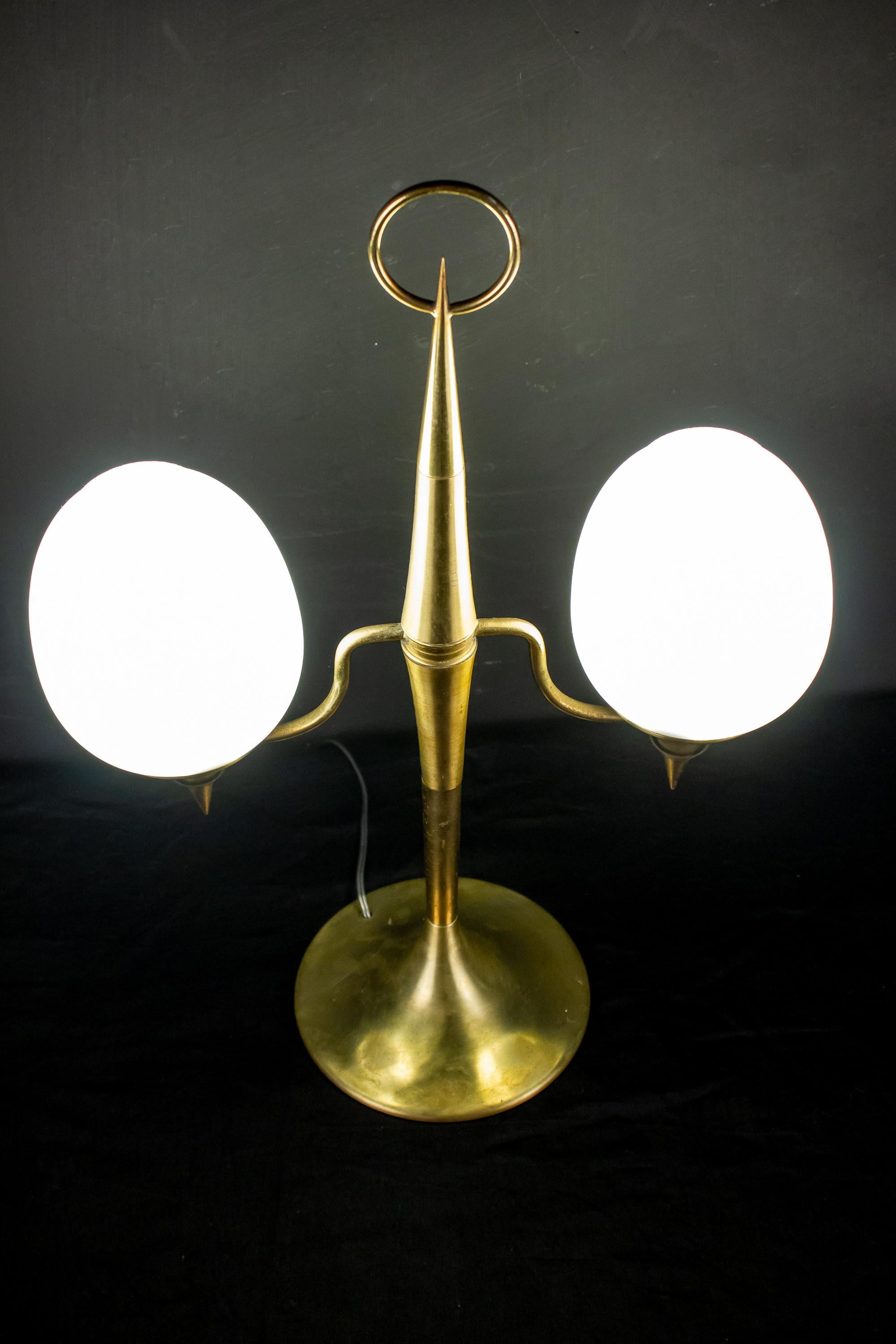 Elegant brass and opaline Murano glass table lamp attributed to Gio Ponti.
 