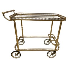 Elegant Brass Finish and Glass Two Tier Neoclassical Style Bar Cart