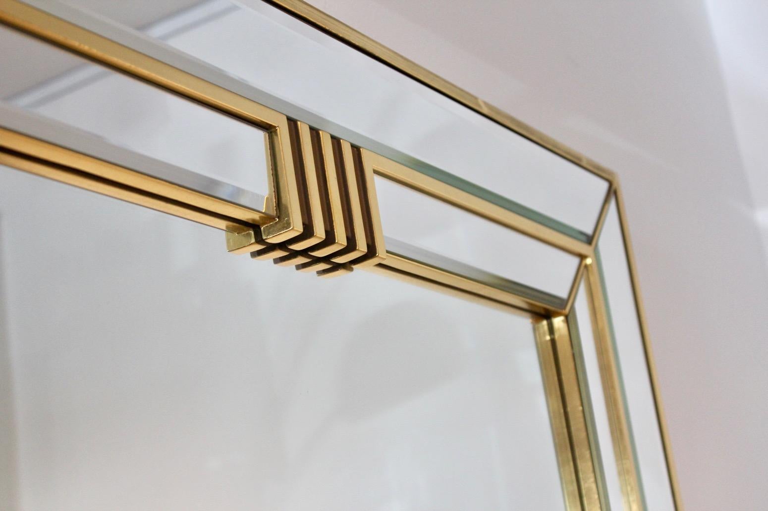 Beautiful large brass framed mirror with sophisticated Graphical design. Made in Belgium by Deknudt in the 1970s. The frame has some wear due to normal use and age. The mirror has a beautiful patina. Very elegant with beautiful and unique inset