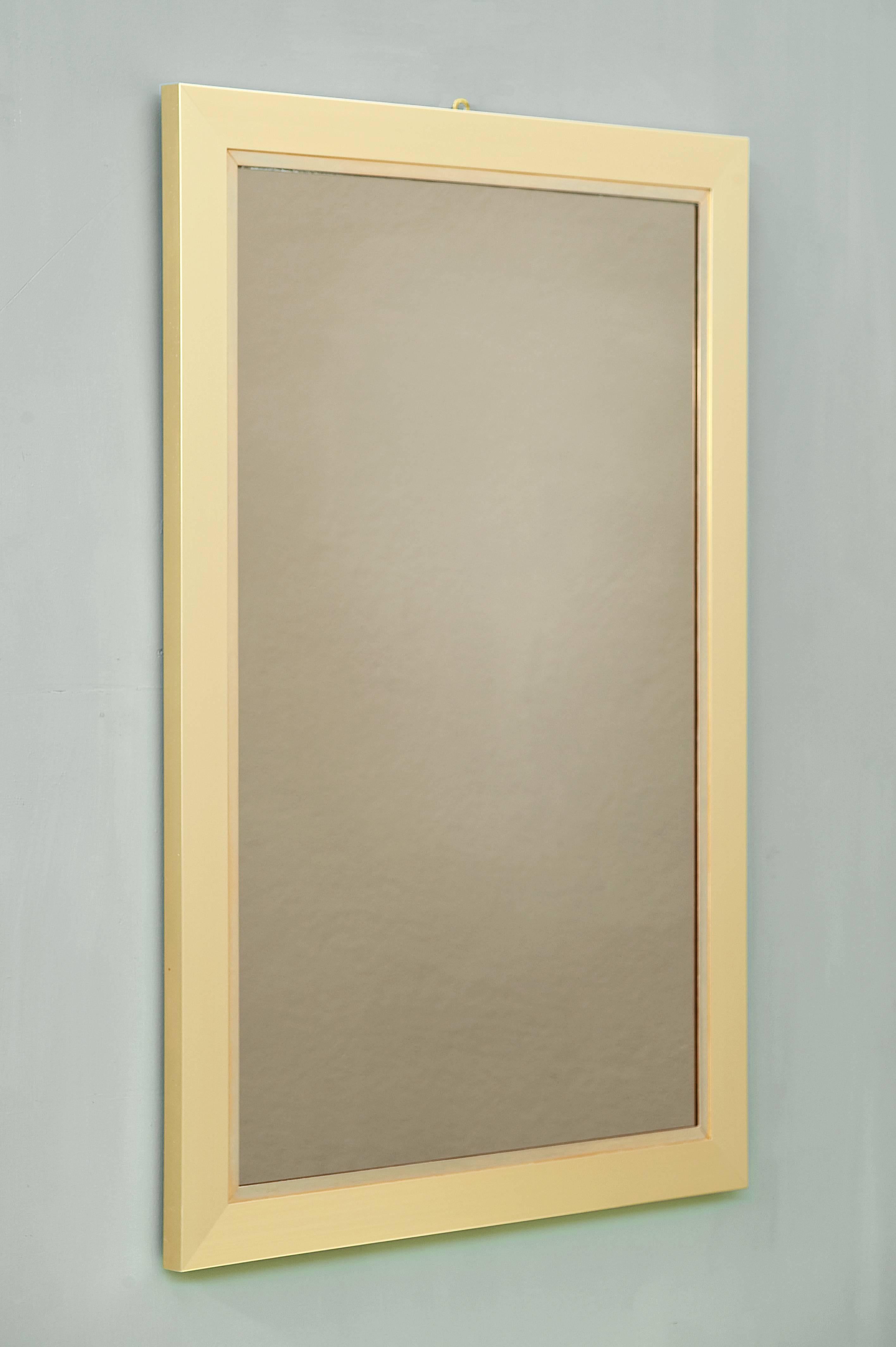 Elegant brass mirror signed by Willy Rizzo on the right up side.
