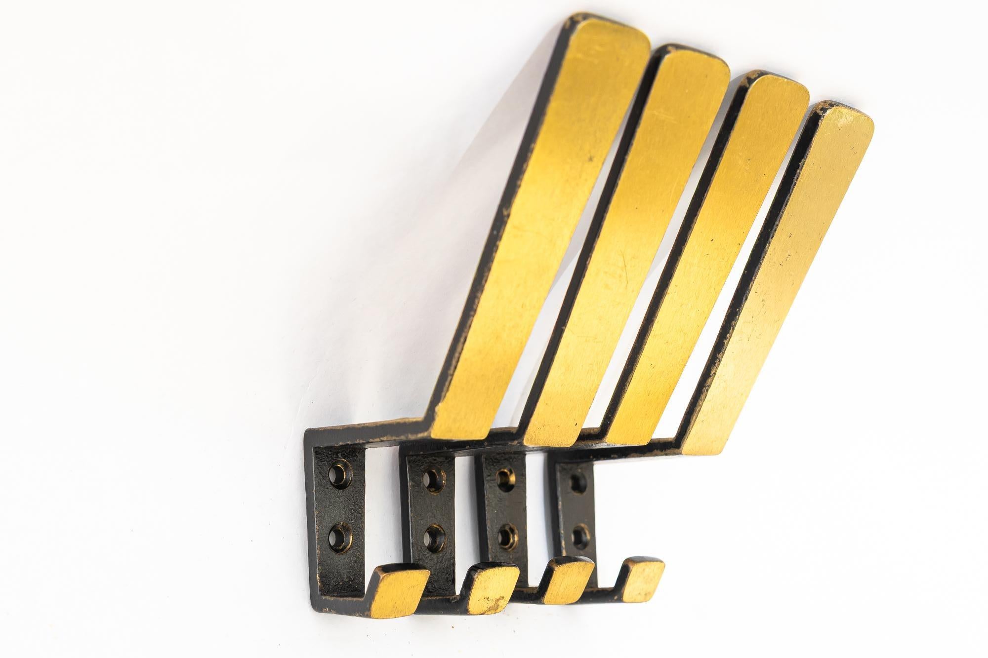 Blackened Elegant Brass wall hooks around 1950s For Sale