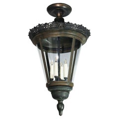 Elegant Bronze Lanter featuring curved glass panels.