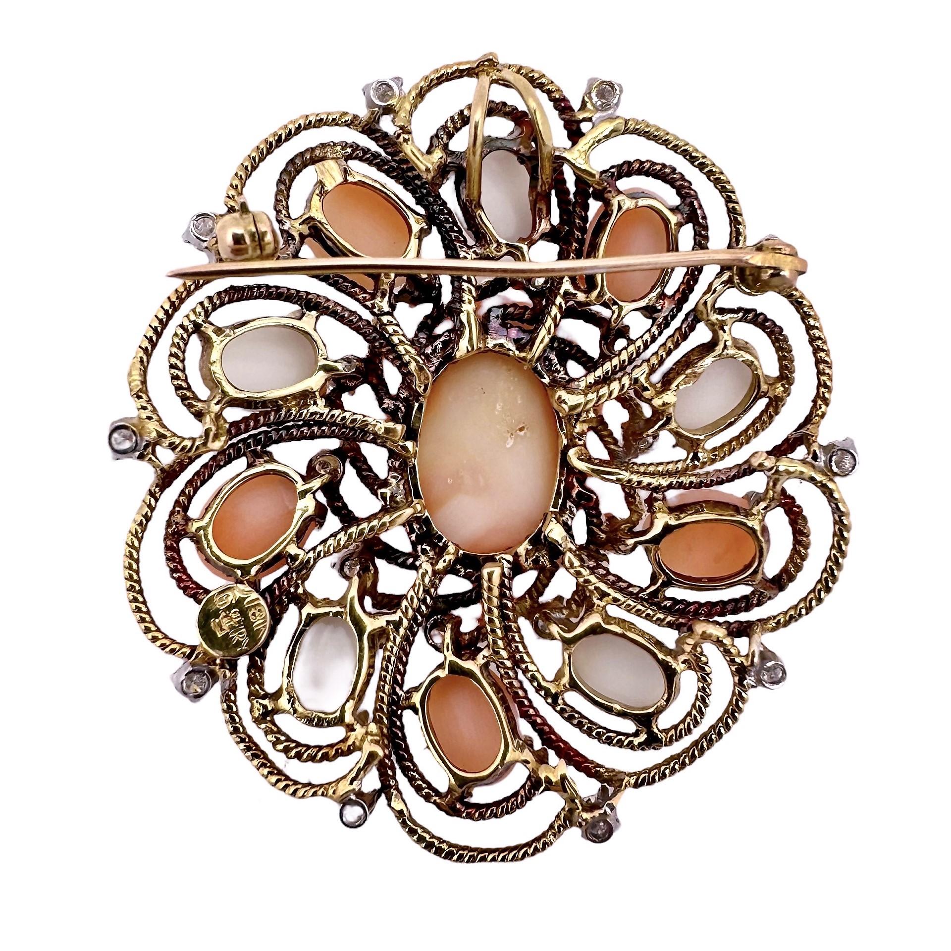 This elegant brooch/pendant is ideal for wear in the summer with white or light coral colored apparel. It is made from hand pulled and twisted 18k yellow gold wire and is set with one fine Angel Skin Coral cabochon measuring 7/8 inches by 5/8 inches