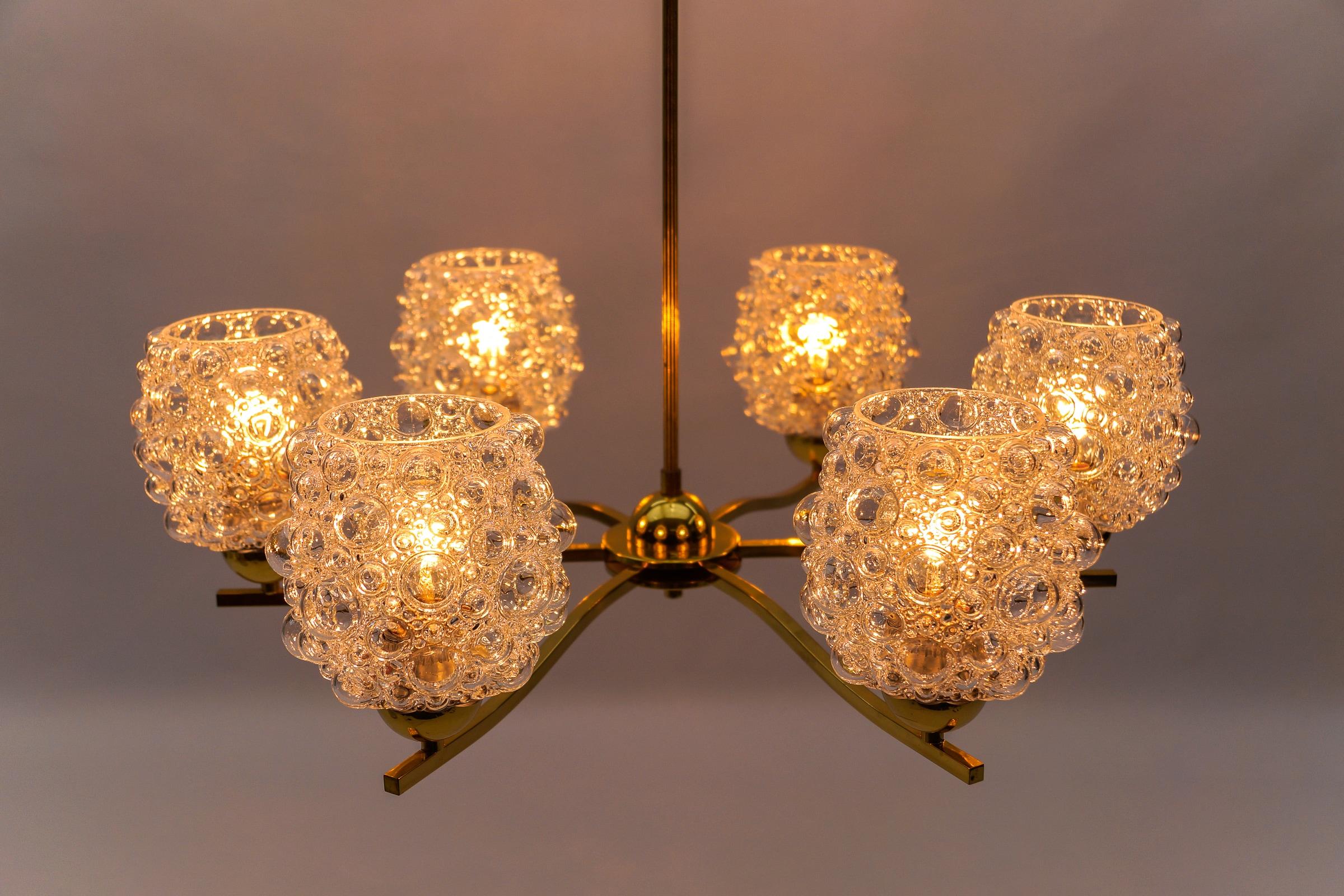 Awesome Bubble Glass Ceiling Lamp by Helena Tynell for Limburg, Germany 1960s

Executed in glass, metal and brass. The lamp needs 6 x E27 Edison screw fit bulb, is wired, in working condition and runs both on 110 / 230 volt.

Our lamps are checked,