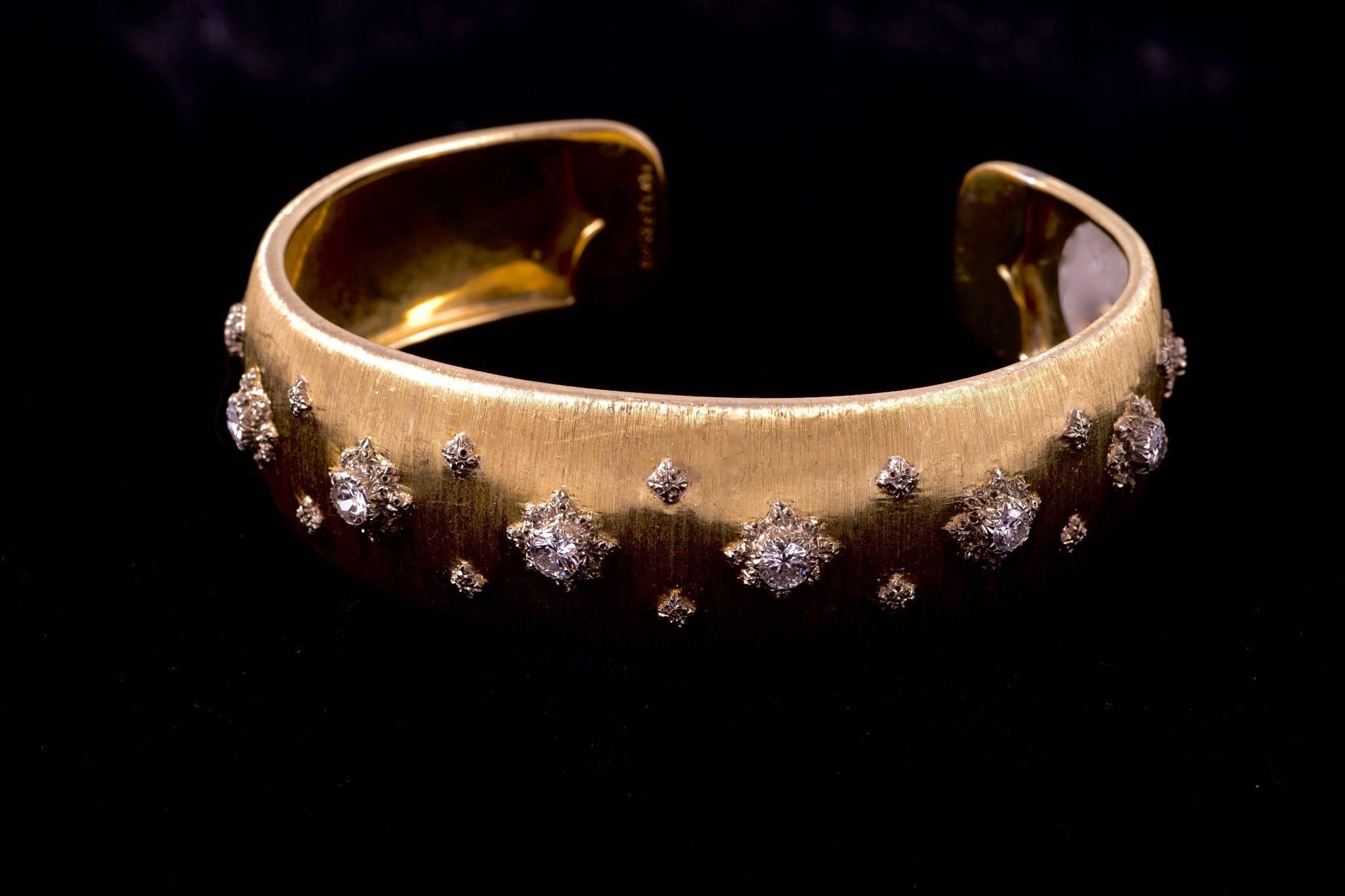 Elegant Buccellati 18k yellow Gold and Diamond Bangle Bracelet.  Seven round brilliant cut diamonds weighing 1.40cts and have G color and  VS-SI clarity. 