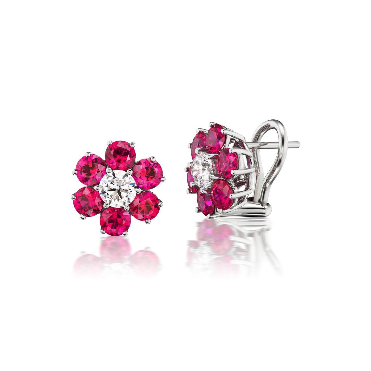 Bright red Burmese Rubies surround glossy white diamonds to form an exquisite floral pattern. These earrings were beautifully set in 18K White Gold

Item #: 04141
Ruby Weight: 3.41 cts. (12 pcs)
Diamond Weight: 1.00 ct
Metal: 18K White Gold