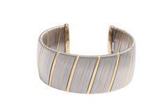 Elegant Cartier Two-Tone Gold & Steel Cuff Bracelet – Modern Classic Design