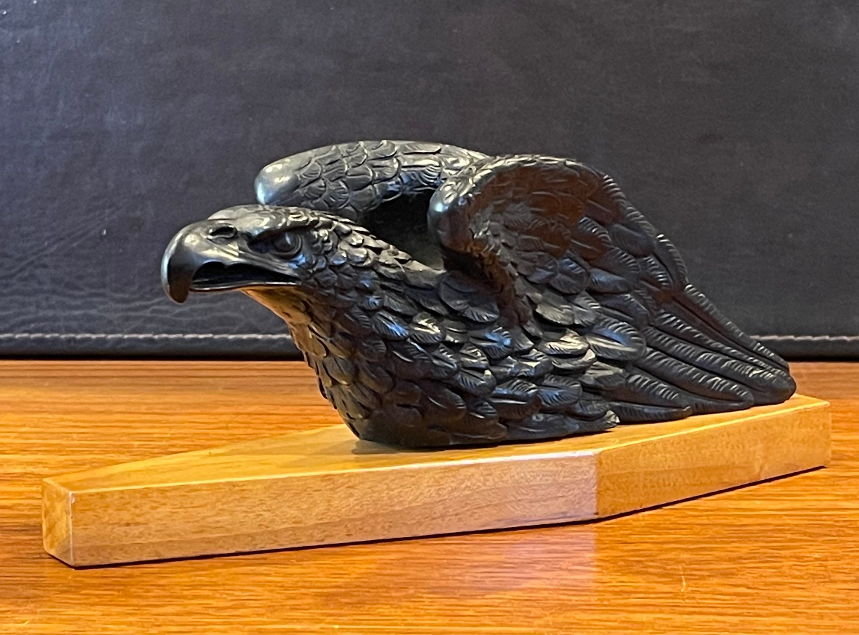 Elegant carved bald eagle on wood base pipe holder / stand / rest by Dunhill, circa 1950s. The eagle has amazing carved detail and I believe is made of wood (if not wood, it is some type of resin or possibly meerschaum - very hard to tell). The