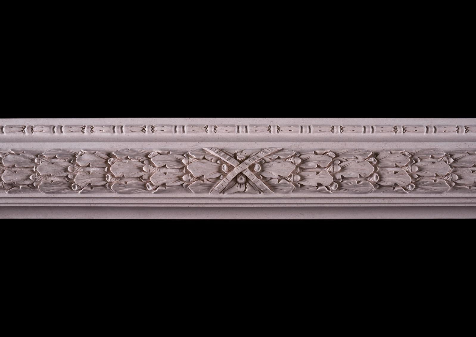 An elegant carved bolection moulded fireplace in a light limestone. The frieze and jambs with carved oak leaf decoration and cross banded centre ribbon to centre. A copy of a period original. Could be made to any size in various materials if
