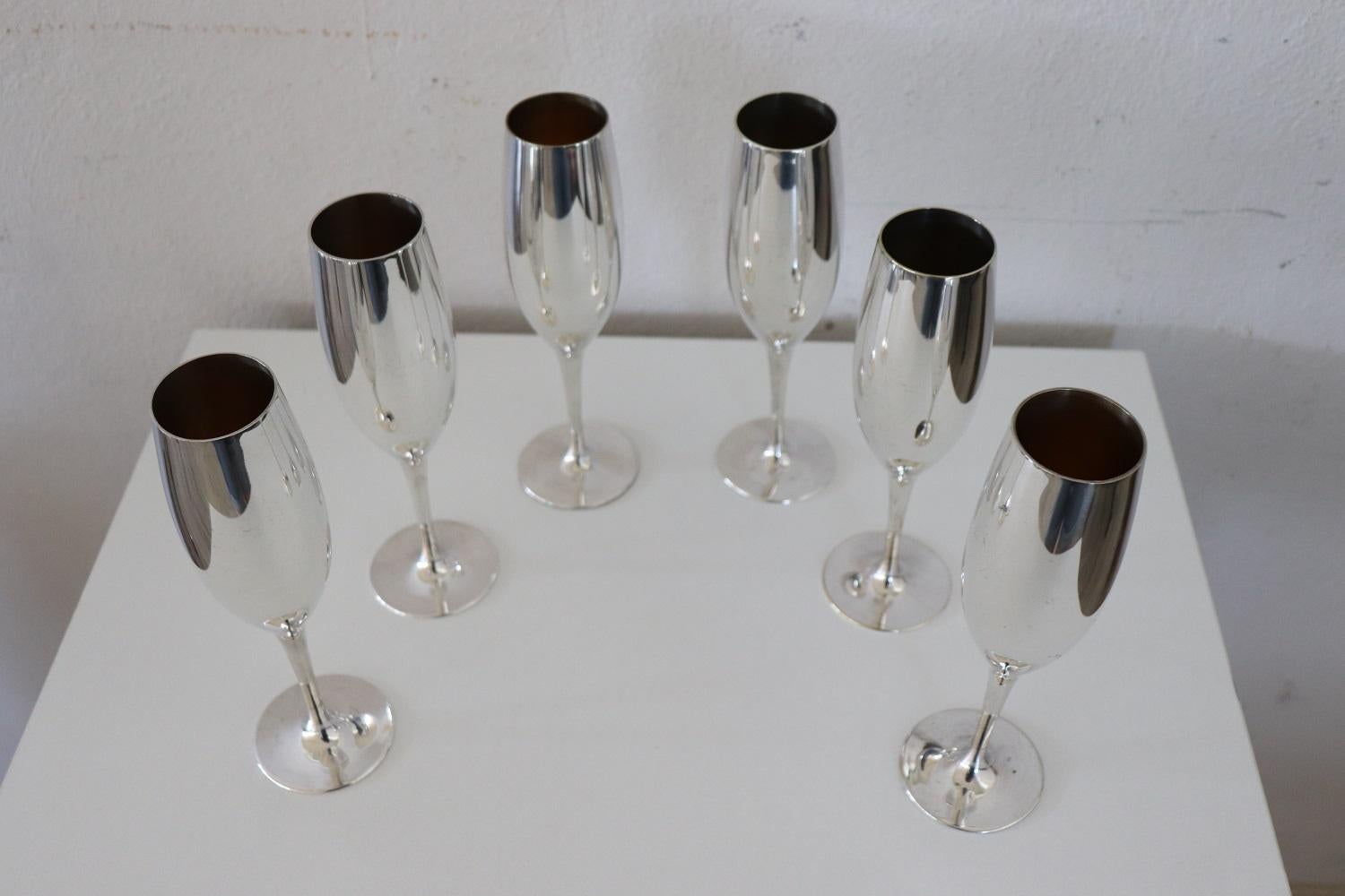 Beautiful set of six flute glasses in silver plated perfect for champagne. No brand present. Used but in good condition.