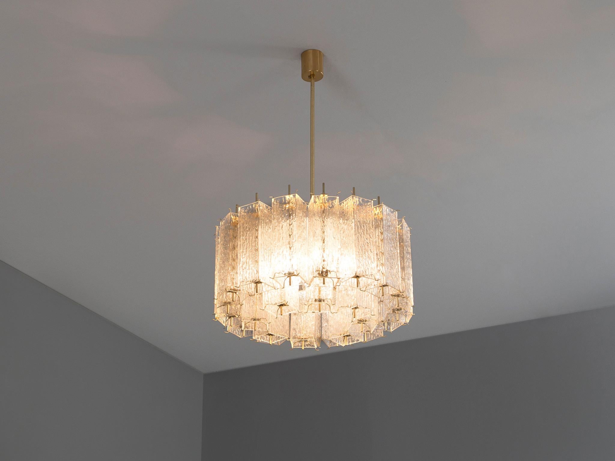 Chandelier, brass, glass, France, 1960s

Magnificent large round brass chandelier of French origin with twenty-four textured glass shades. This lamp is handcrafted and consists of two alternating rows. The inner row is composed of eight glass