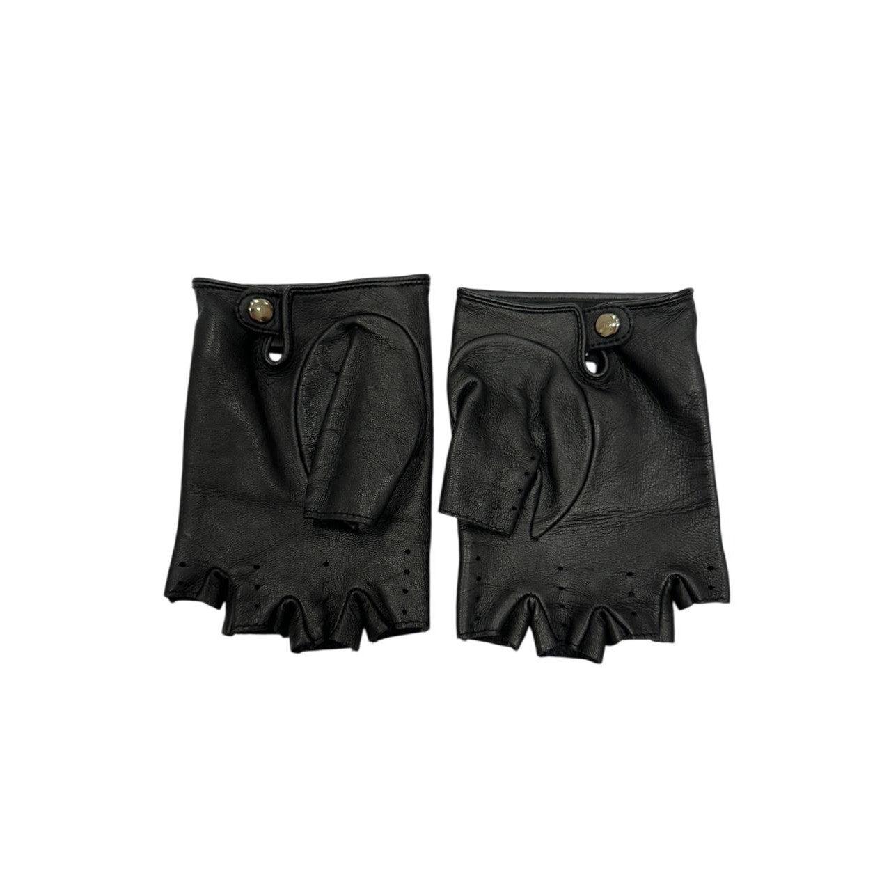 Add a touch of luxury to your wardrobe with these elegant Chanel fingerless gloves! Featuring a unique laser-cut CC detail, these gloves are sure to turn heads.

In very good condition, these gloves are ready for a new home. Please note that they