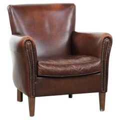 Elegant characterful vintage armchair made of sheepskin leather