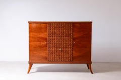 Elegant cherry bar cabinet with diamond-cut wood front by Paolo Buffa