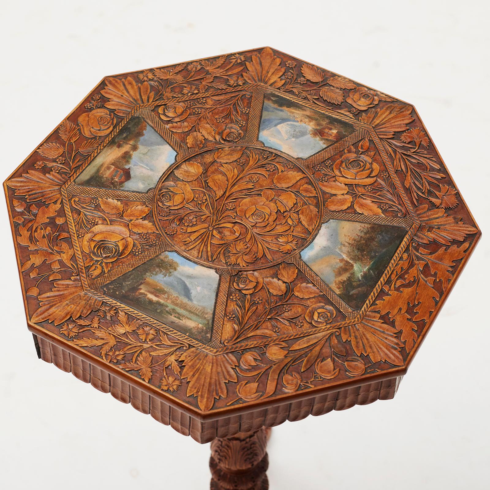 Elegant table made of cherrywood, tabletop with carvings and paintings. Three-step foot with animal table legs. 2 drawers. Ant. Italy, circa 1840.