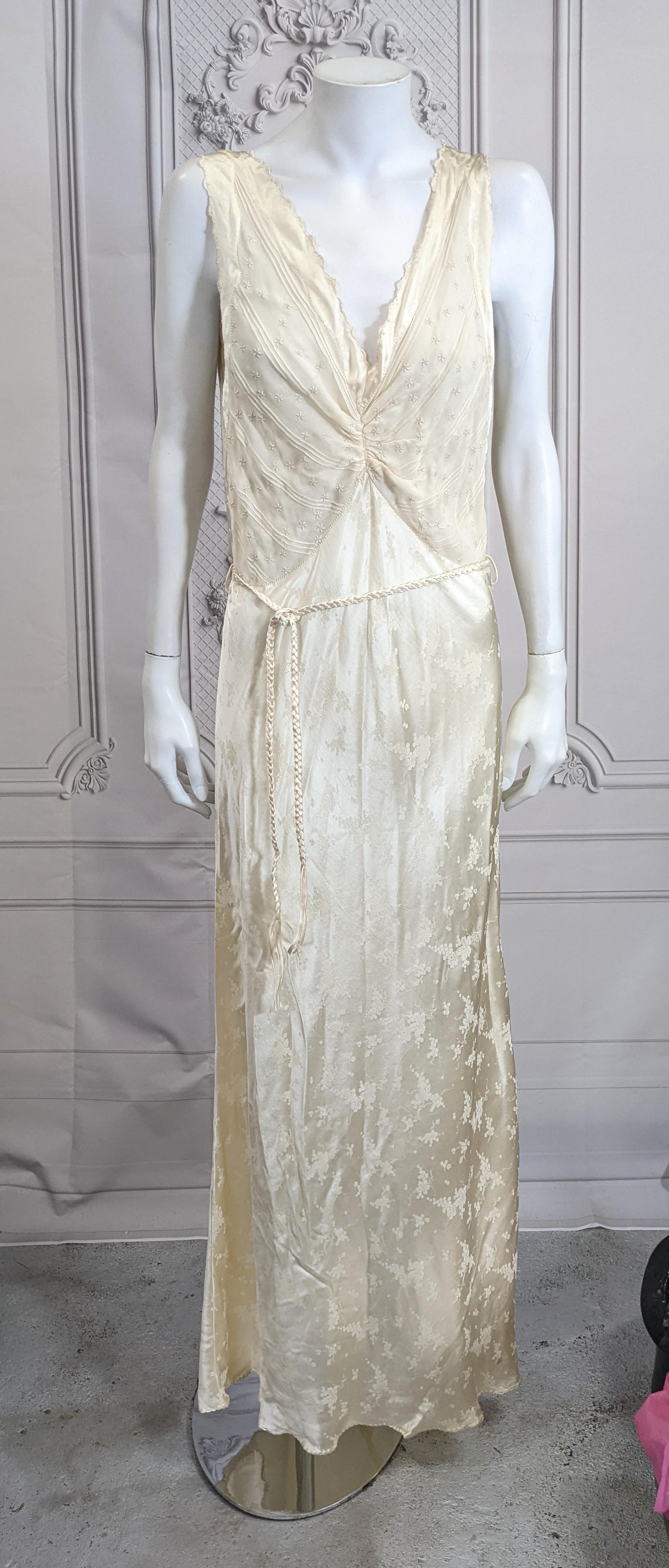 Elegant Chiffon and Satin Art Deco Slip from the 1930's. Bias cut doubled chiffon is used in the bodice (sheer) embroidered with hundreds of flower heads and pintucks. The skirt is bias cut silk satin crepe with grape motifs. Deep armholes and