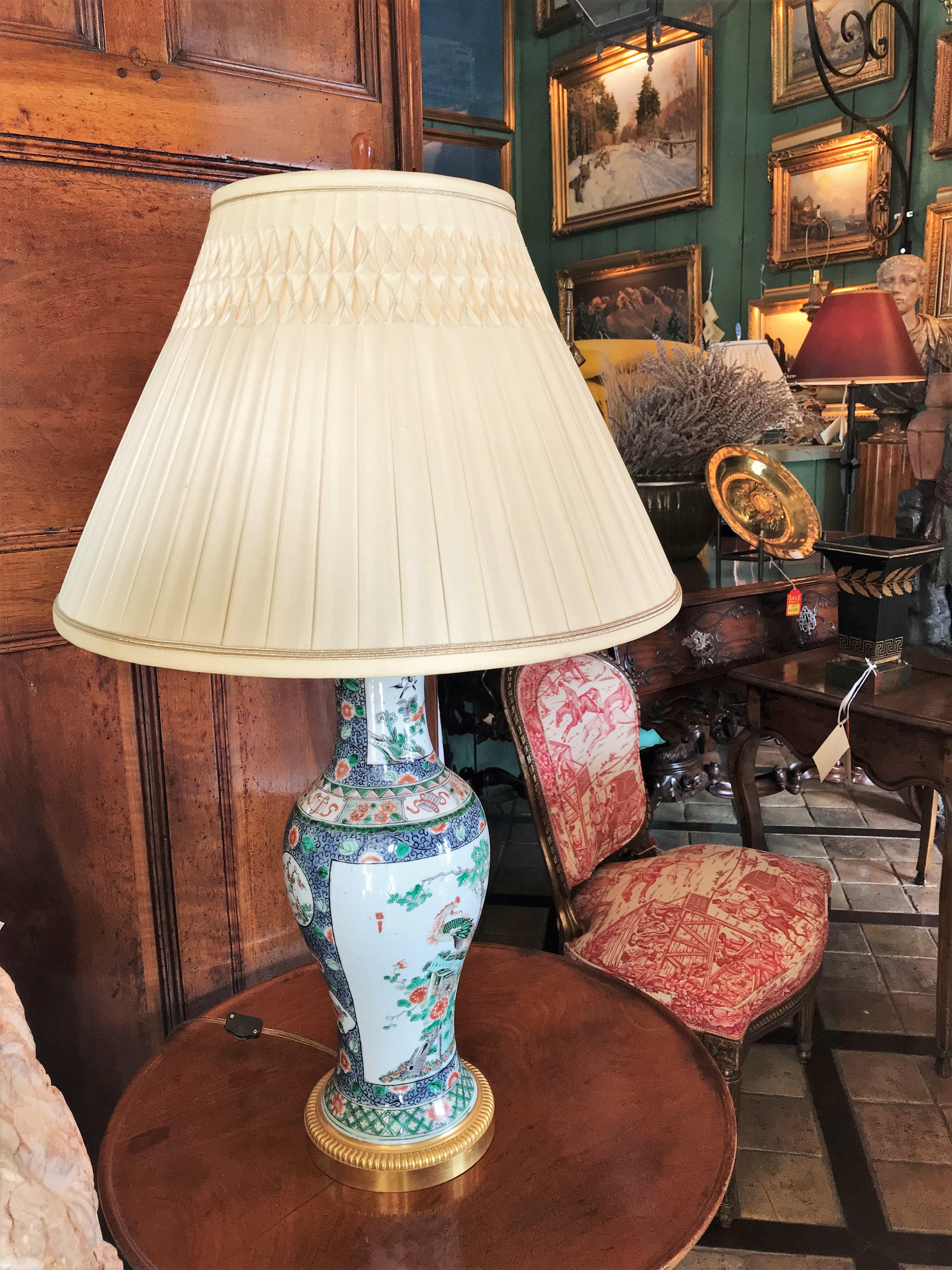 Elegant Chinese Famille Rose Vase and Gilt Bronze Mount, Side Table Lamp antique . Very fine 19th century Chinese Famille rose Baluster vases with 19th century gilt bronze mounts wired as lamps With Amber finial. Decorated with an array of symbolic
