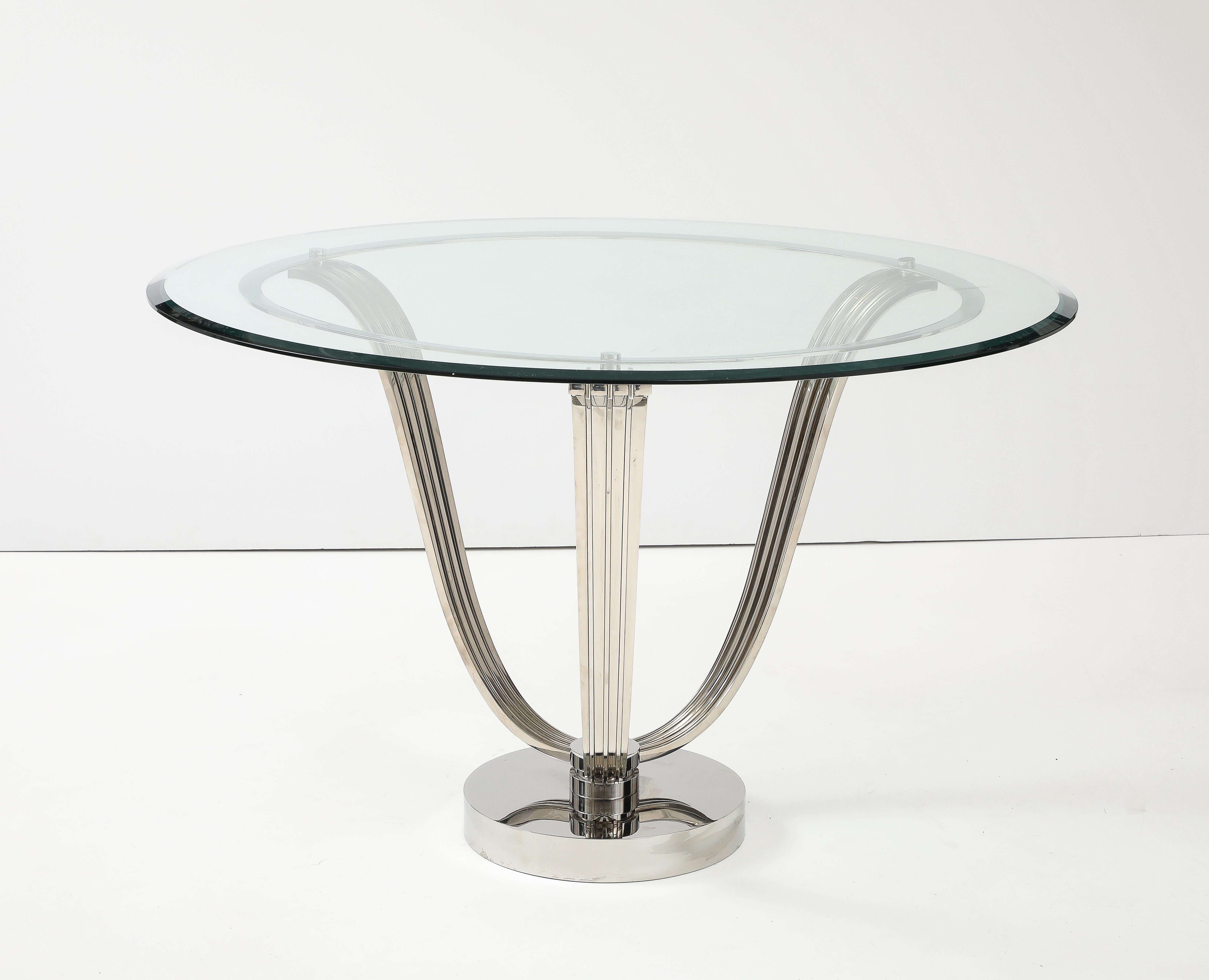 Glamorous 1980's polished  chrome Tulip table possibly by Karl Springer.
The beautifully constructed heavy polished chrome base has 3  channeled Tulip style leaf supports which hold a 50