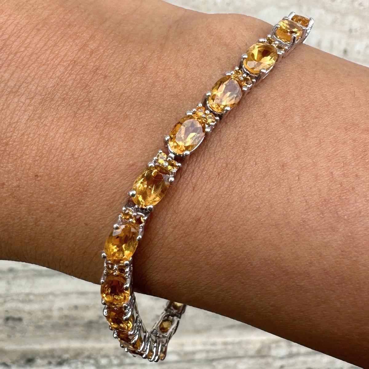 Elegant Citrine Tennis Bracelet in sterling silver showcases endlessly sparkling natural citrine, weighing 11.15 carat. It measures 7 inches long in length. 
Citrine stimulate concentration and reduces stress. 
Designed with perfect oval, round cut