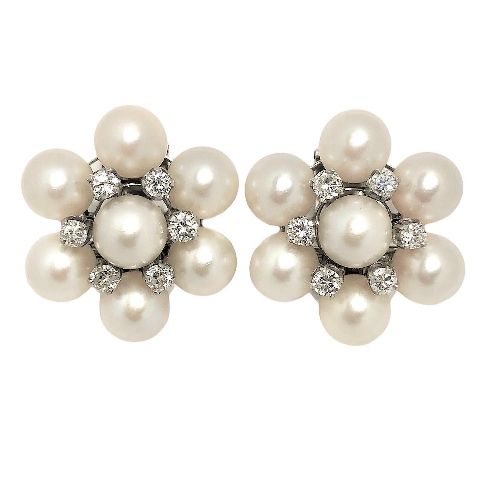 This gracious pair of 14k white gold, Akoya cultured pearl and diamond earrings was created by a very talented maker some time during the middle of the last century.  Set with a total of fourteen overall light greenish, cream rose color, 7.25mm