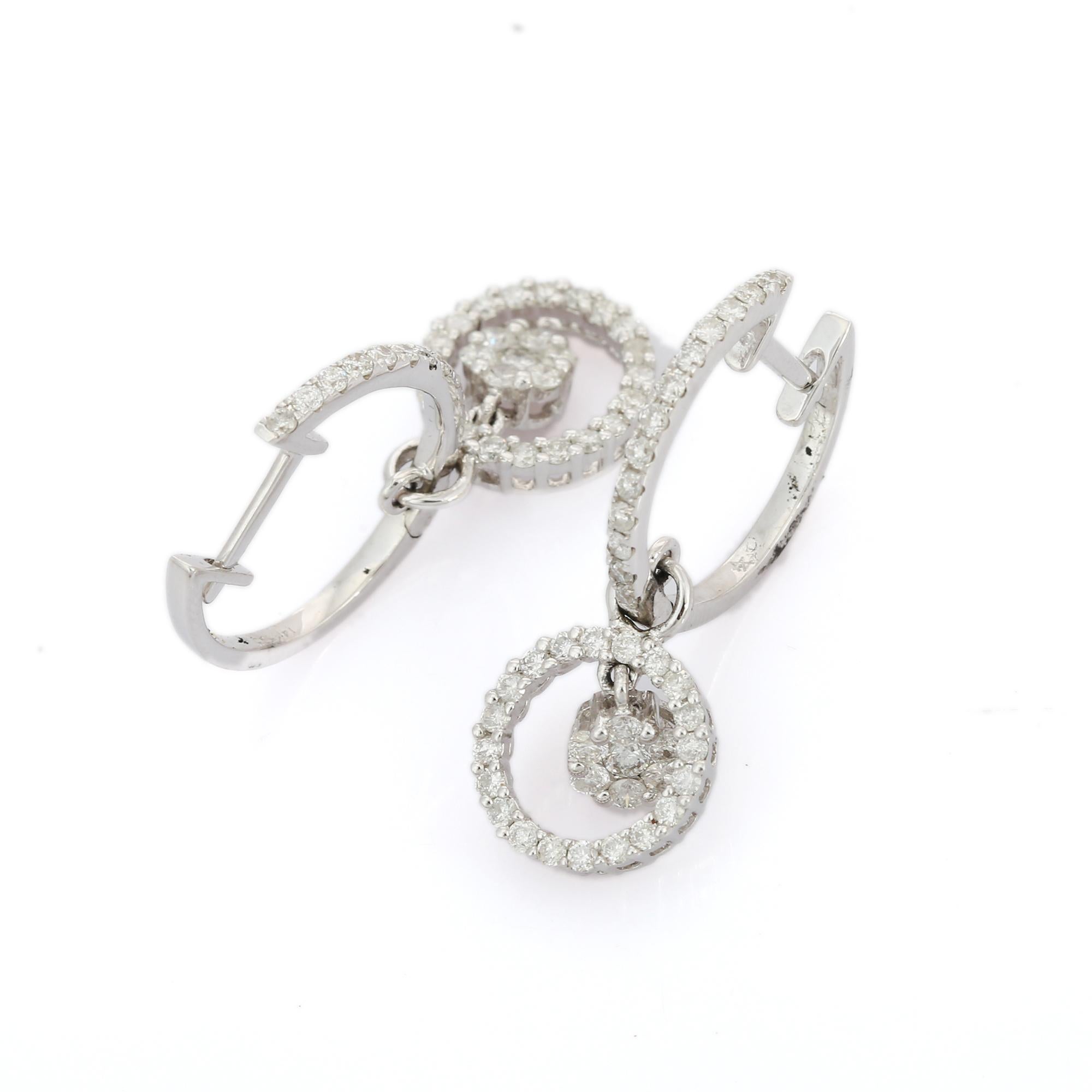 14K White Gold Diamond Clip-On earrings to make a statement with your look. These earrings create a sparkling, luxurious look featuring round cut diamonds. Diamonds are known for their ability to improve one's health and intelligence. 
If you love
