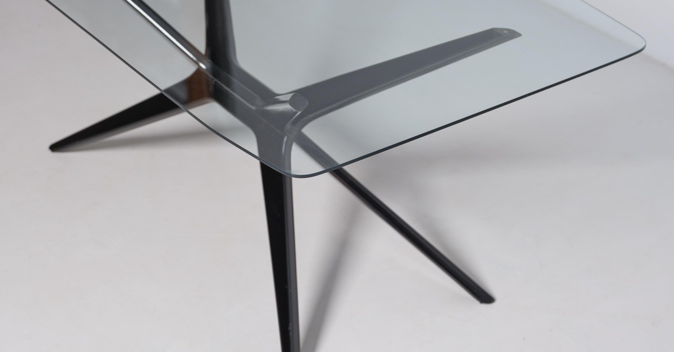 Introducing our exquisite Italian-made coffee table, crafted with the highest level of artisanship. This grand coffee table features a sleek glass top with rounded corners, perfectly blending modern design with timeless elegance. The table stands on