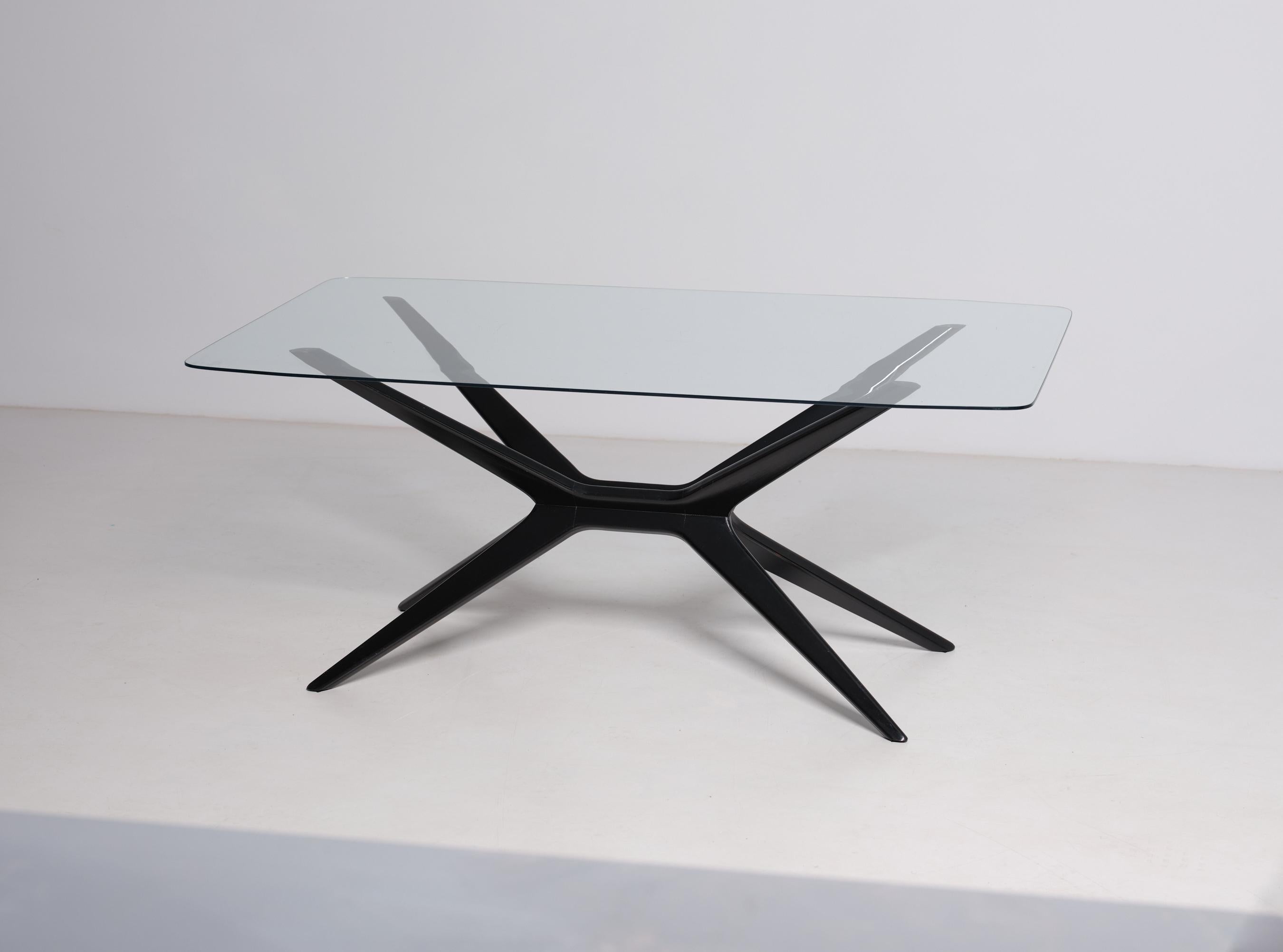 Italian Elegant Coffee Table with Glass Top and Sleek Black Legs For Sale