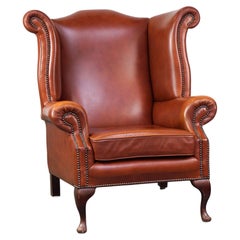 Elegant, comfortable English Chesterfield wingback armchair, cowhide leather
